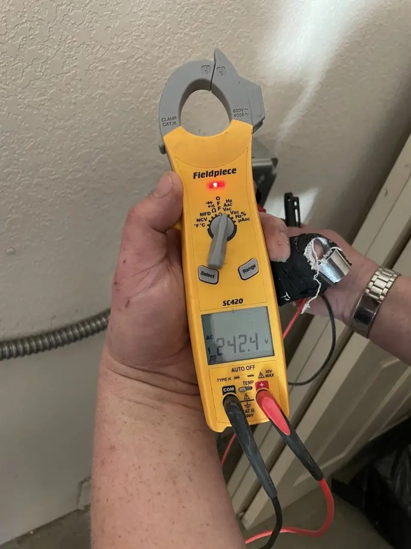 Voltage testing with clamp meter during Whole House Surge Protector in Somers Point